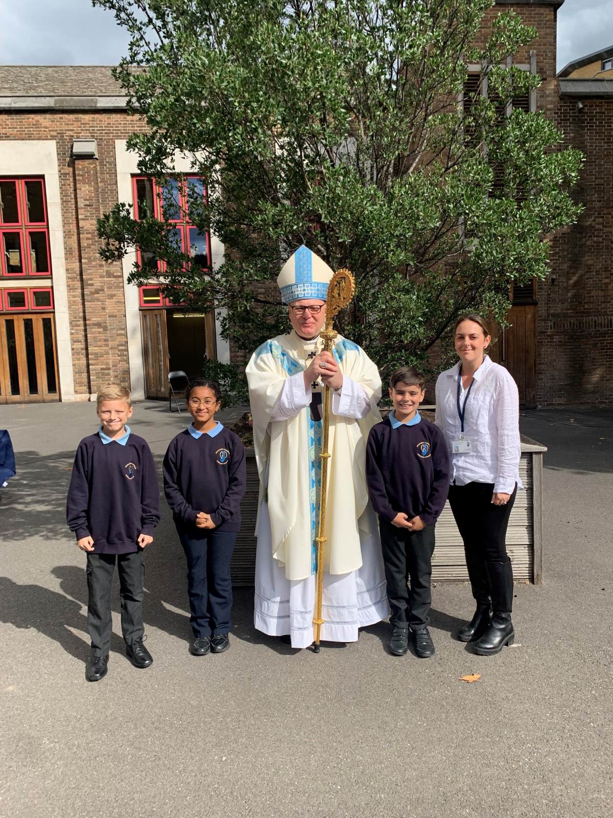 Finlay, Dexter, Grace and Mrs Dengate with Archbishop John Wilson 